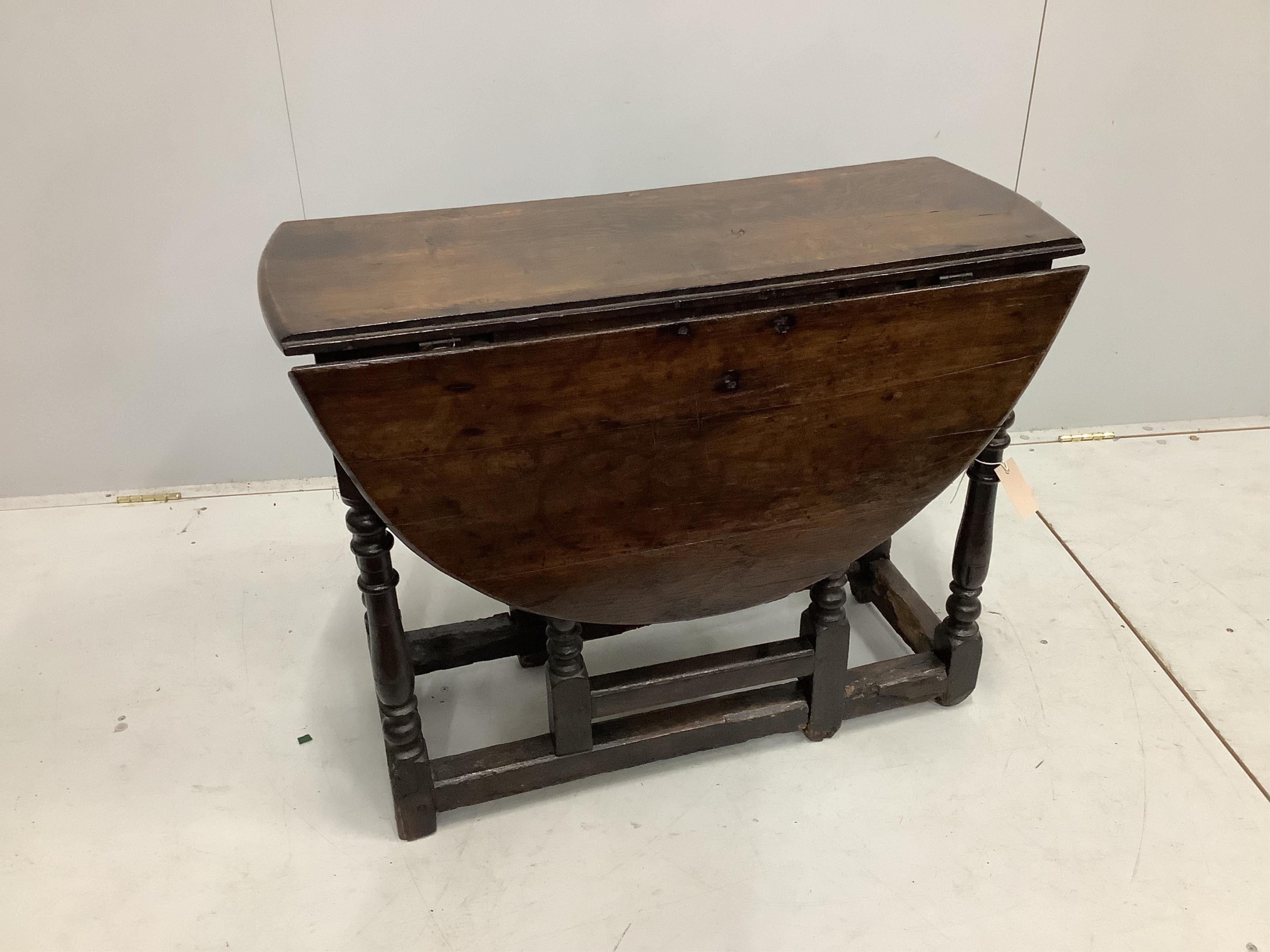 A small 17th century and later oak gateleg table, width 86cm, depth 31cm, height 68cm. Condition - fair